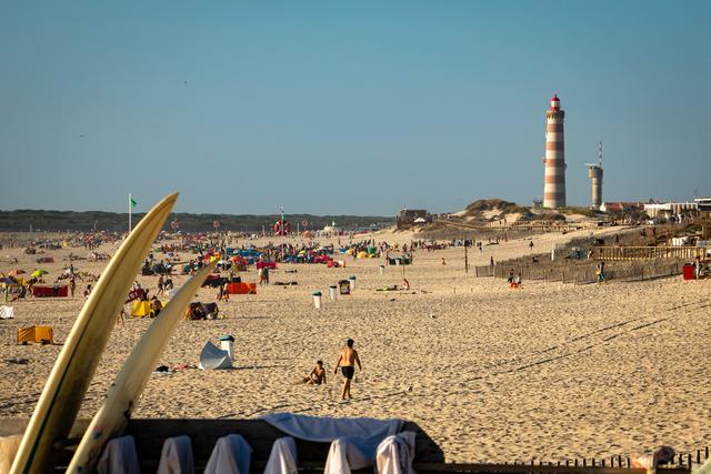 Farol da Barra with surfboard